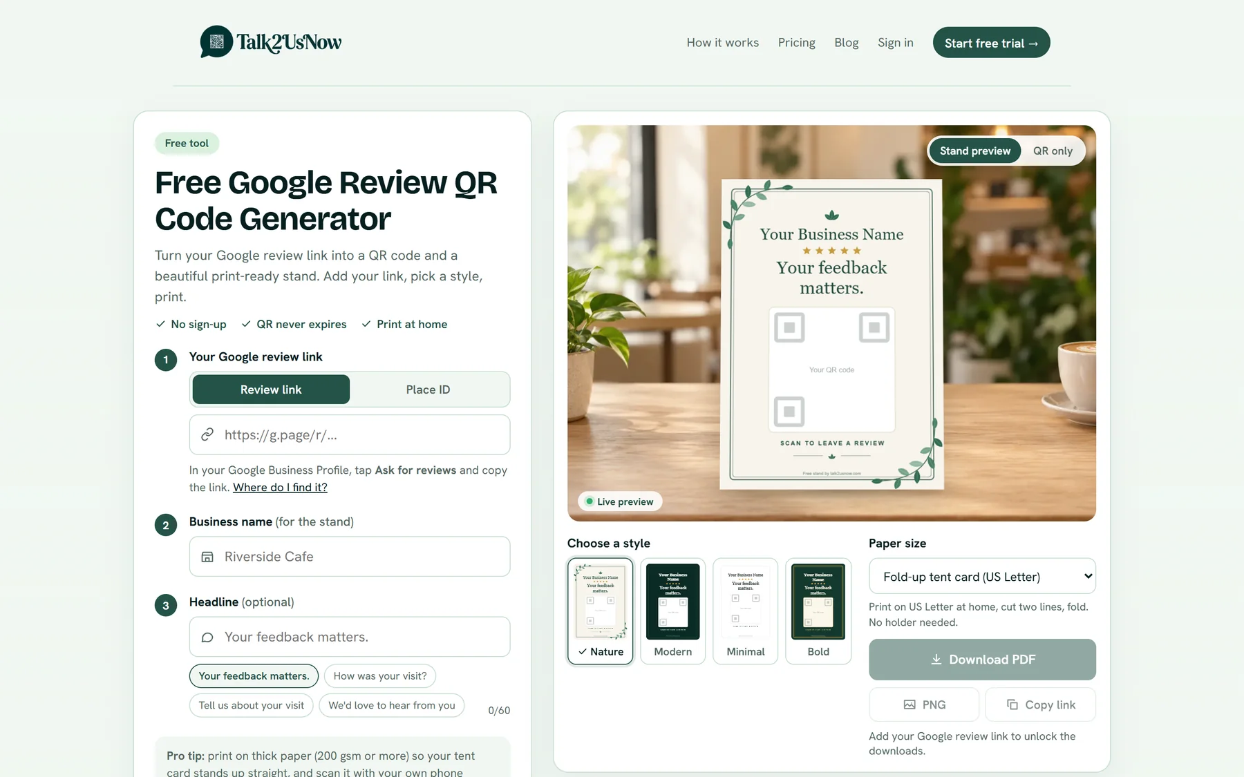 The free Google Review QR Code Generator: a form on the left and a live stand preview on a café table on the right.